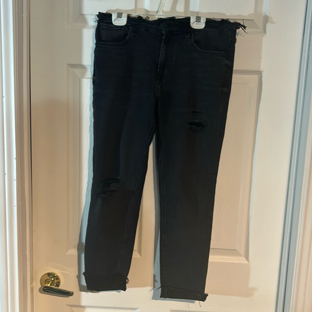 Ladies size 32 Kensie Black Jeans with destruction/raw edge